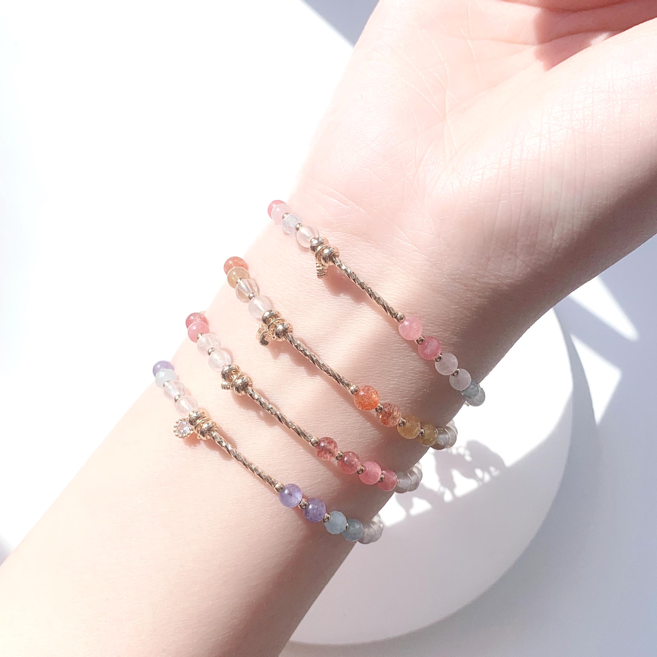 Blonde gold crystal, sun pink crystal, aquamarine, moonstone, rhodolite, strawberry crystal, tanzanite gradient color series, 14k gold-filled bracelet