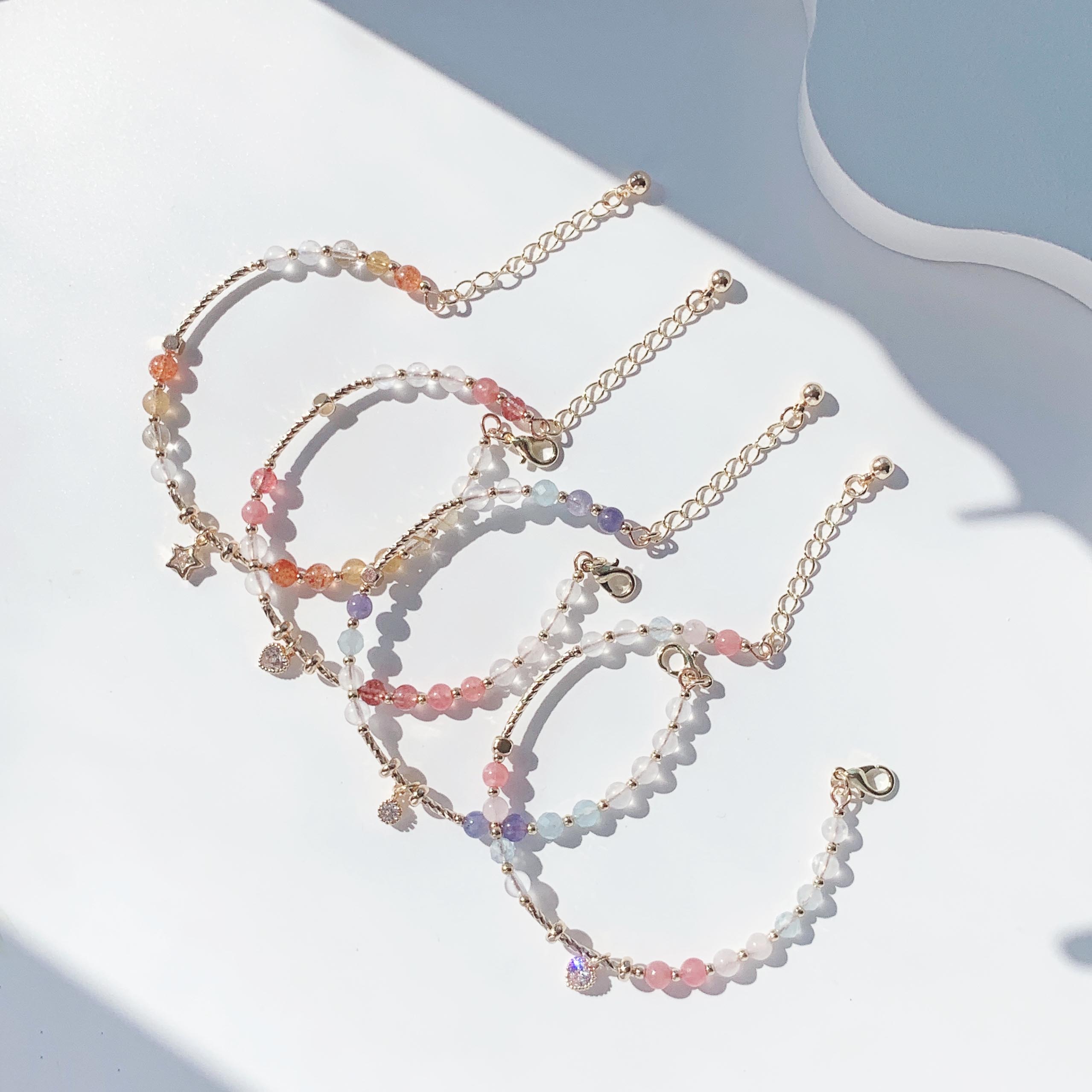 Blonde gold crystal, sun pink crystal, aquamarine, moonstone, rhodolite, strawberry crystal, tanzanite gradient color series, 14k gold-filled bracelet