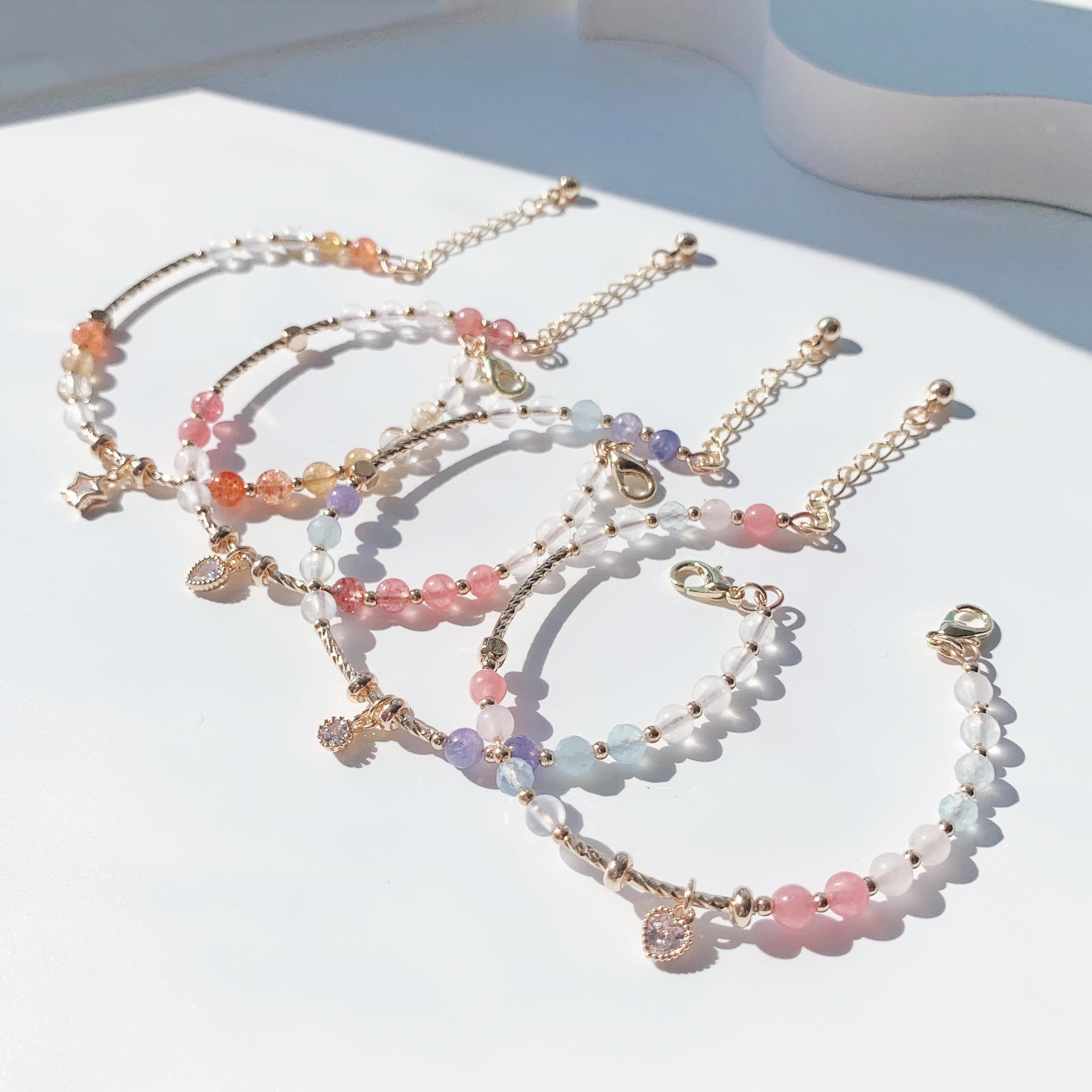 Blonde gold crystal, sun pink crystal, aquamarine, moonstone, rhodolite, strawberry crystal, tanzanite gradient color series, 14k gold-filled bracelet