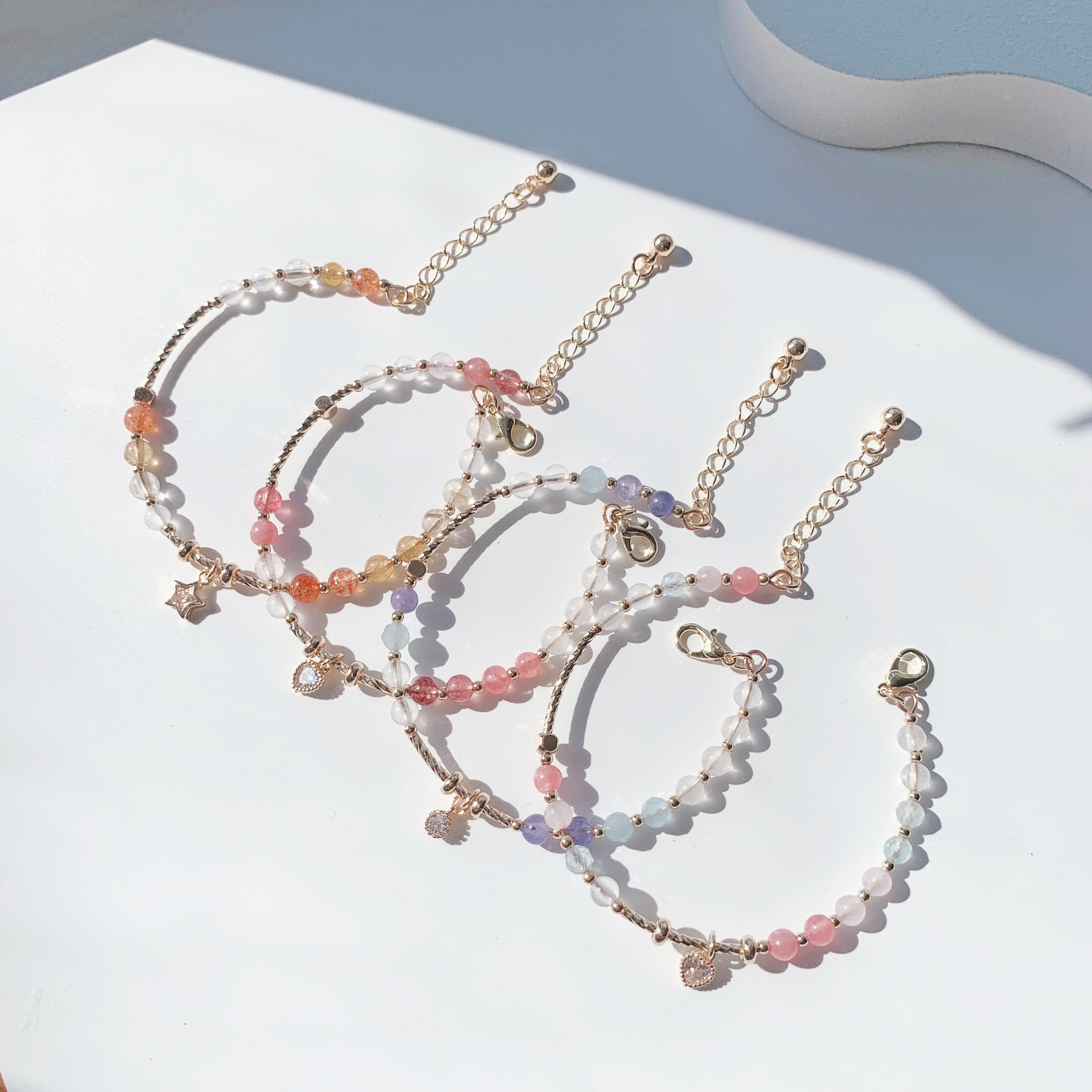 Blonde gold crystal, sun pink crystal, aquamarine, moonstone, rhodolite, strawberry crystal, tanzanite gradient color series, 14k gold-filled bracelet